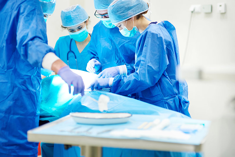Surgery team in the operating theater working on a patient